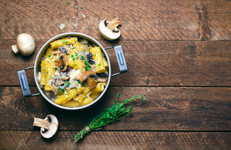 Creamy Mushroom Pasta with Fresh Thyme and Parmesan in a Vintage Pot, Italian Cuisineの写真素材