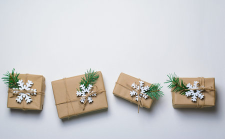 Christmas Gifts with Fir Branches and Wooden Snowflakes on White Background, Winter Holidays Concept