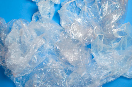 Plastic Bags on Blue Background, Recycle and Used Plastic Problem Concept
