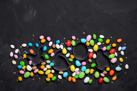 Easter Concept, Chocolate Eggs and Cookie Cutters on Black Background, Sweet Easter Treat, Copy Spaceの写真素材