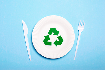 Recycling Symbol, Plastic Cutlery and Plate over Light Blue Background, Waste and Plastic Pollution Conceptの写真素材