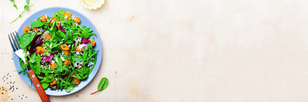 Roasted Pumpkin Healthy Vegetarian Salad, Butternut Squash, Rice and Sesame Seeds Salad over Bright Backgroundの写真素材