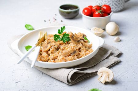 Spelt with Mushrooms on a Plate, Tasty Homemade Vegetarian Dishの写真素材