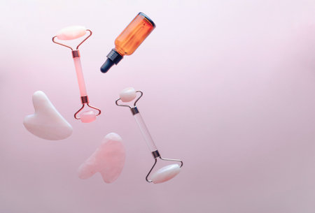 Rose Quartz Roller and Gua Sha Tool, Facial Lifting Scraping Massage Treatmentの写真素材