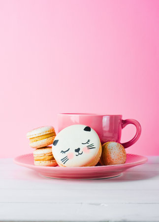 Adorable Cat Macaron Cookies, Delicious French Dessert on Bright Backgroundの写真素材