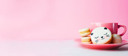 Adorable Cat Macaron Cookies, Delicious French Dessert on Bright Backgroundの写真素材