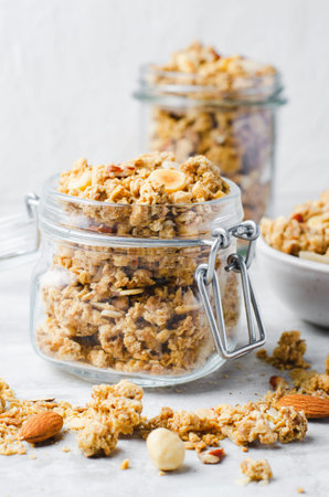 Granola with Nut Mix on Bright Concrete Background, Healthy Snack or Breakfast