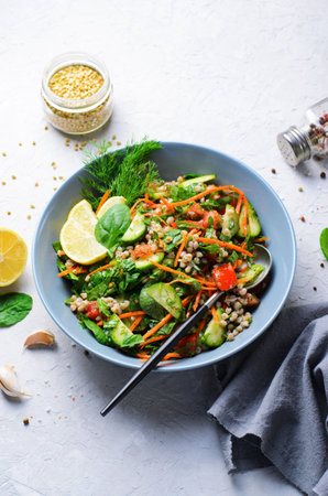 Green Buckwheat Salad with Spinach, Herbs and Vegetables, Healthy Vegetarian Mealの写真素材
