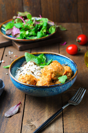 Meatballs with Rice Mix, Tasty Homemade Meal on Wooden Rustic Backgroundの写真素材