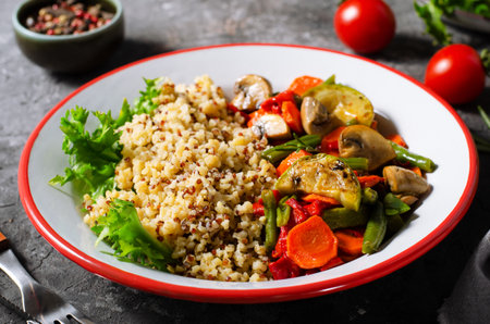 Quinoa with Vegetables, Healthy Meal, Vegetarian Food on Dark Backgroundの写真素材