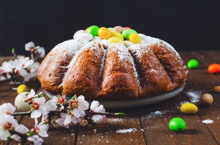 Easter Cake, Traditional Cake Decorated with Sugar Eggs on Wooden Backgroundの写真素材