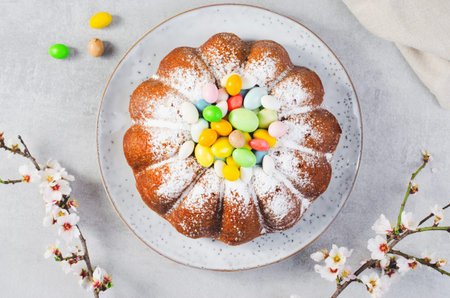 Easter Cake, Traditional Cake Decorated with Sugar Eggs on Bright Grey Background