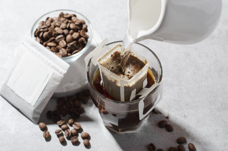 Drip Coffee Bag in a Cup, Coffee Trend, Quick Way to Brew Ground Coffee Using Paper Type Filterの写真素材