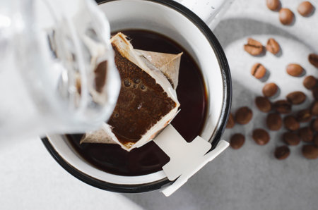 Drip Coffee Bag in Big Cup, Coffee Trend, Quick Way to Brew Ground Coffee Using Paper Type Filterの写真素材