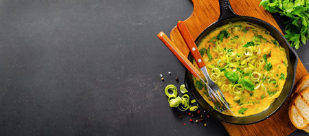 Omelette with Leek and Herbs, Delicious Snack or Breakfast on Wooden Backgroundの写真素材