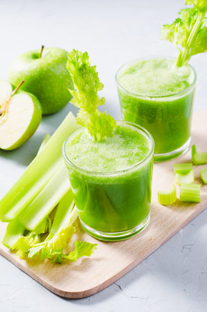 Fresh Green Smoothie With Celery and Apples, Detox Drink on Bright Background, Healthy Dietの写真素材