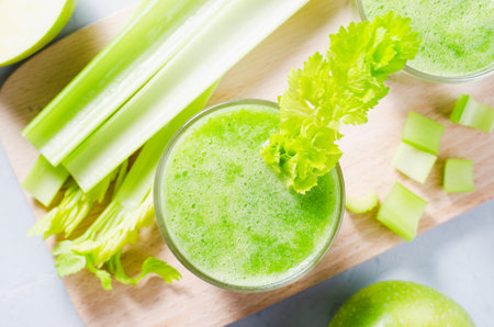 Fresh Green Smoothie With Celery and Apples, Detox Drink on Bright Background, Healthy Dietの写真素材