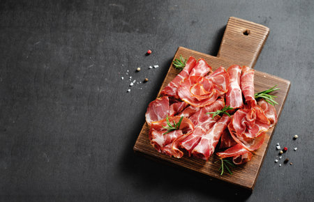 Cured Meat Platter, Antipasto, Appetizer on a Boardover Dark Backgroundの写真素材
