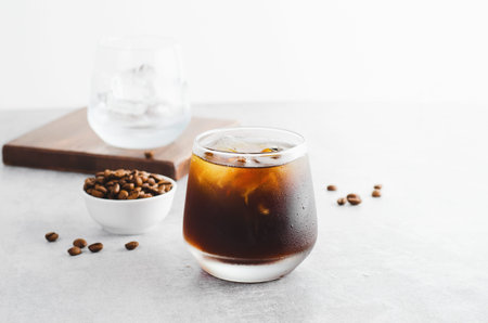 Iced Coffee, Cold Brew Coffee with Ice on Bright Light Grey Background, Refreshing Beverage