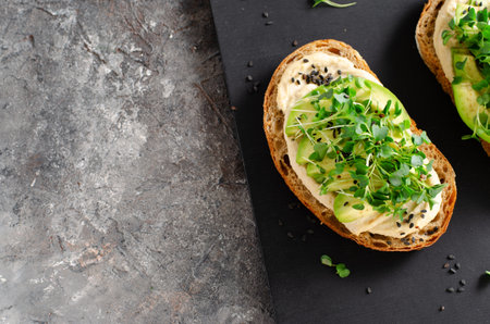 Avocado Hummus Toast, Healthy Snack, Vegan Breakfast, Vegetarian Mealの写真素材