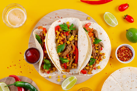 Mexican Tacos with Beef and Vegetables, Tacos al Pastor on Bright Yellow Backgroundの写真素材