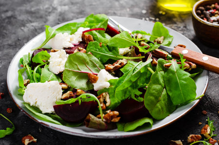 Fresh Salad with Beetroot, Feta Cheese, and Pecans, Vegetarian Meal on Dark Background