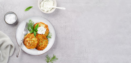 Zucchini Fritters with Herbs and Cream Cheese Topping, Tasty Vegetable Pancakes, Vegetarian Mealの写真素材