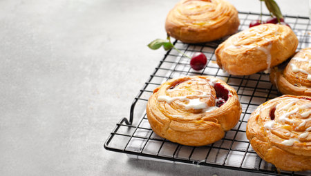 Freshly Baked Puff Pastry with Cherries on Bright Light Grey Backgroundの写真素材