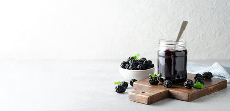 Blackberry Jam in a Jar, Tasty Homemade Berry Jam on Bright Background