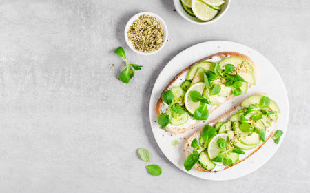 Avocado Toasts with Microgreen, Healthy Snack or Breakfast on Bright Background