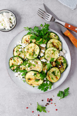 Grilled Zucchini, Feta and Herbs Warm Appetizer, Salad on Bright Grey Backgroundの写真素材