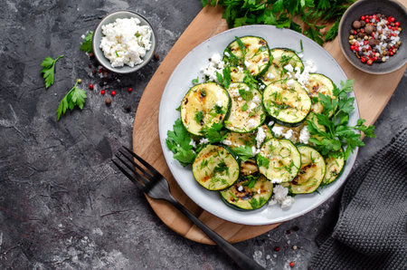 Grilled Zucchini, Feta and Herbs Warm Appetizer, Salad on Dark Rustic Backgroundの写真素材