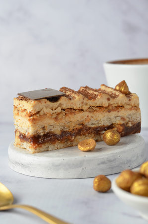 Caramel and Hazelnut Cake, Dacquoise Cake on Bright Background, Tasty Dessert