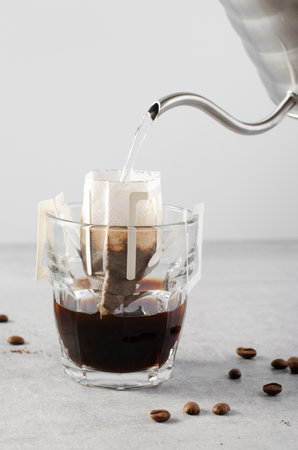 Drip Coffee Bag in a Cup, The Process of Brewing Coffee, Quick Way to Brew Ground Coffee Using Paper Type Filterの写真素材