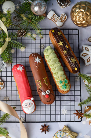 Christmas Eclairs, Various Glazed Festive Eclairs, New Year Dessert on Bright Backgroundの写真素材