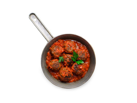 Meatballs in Tomato Sauce in a Frying Pan on White Background Isolatedの写真素材