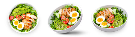 Grilled Chicken Fillet with Fresh Salad, Cherry Tomatoes, Boiled Egg and Avocado, Budha Bowl on White Background, Keto Paleo Diet Menuの写真素材