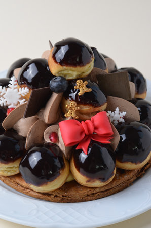 Profiterole Cake, St. Honore Cake with Christmas Decor on Bright Backgroundの写真素材