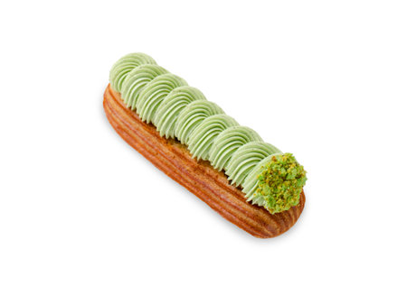 Delicious Pistachio Eclair on White Isolated Background, Eclair with Pistachio Cream and Fillingの写真素材