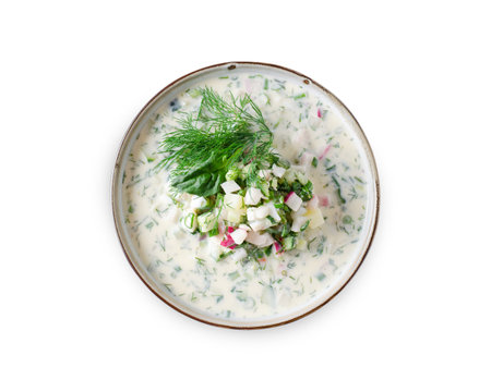 Cold Okroshka Soup with Eggs, Vegetables, Meat, Herbs and Kefir on a White Background Isolated, Summer Soupの写真素材