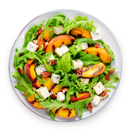 Grilled Peach Salad with Blue Cheese, Pecans and Arugula on White Background Isolatedの写真素材
