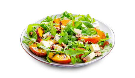 Grilled Peach Salad with Blue Cheese, Pecans and Arugula on White Background Isolatedの写真素材