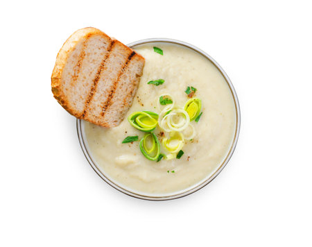 Leek Soup, Comfort Meal, Potato and Leek Creamy Soup, Vegetarian Food on White Background Isolatedの写真素材