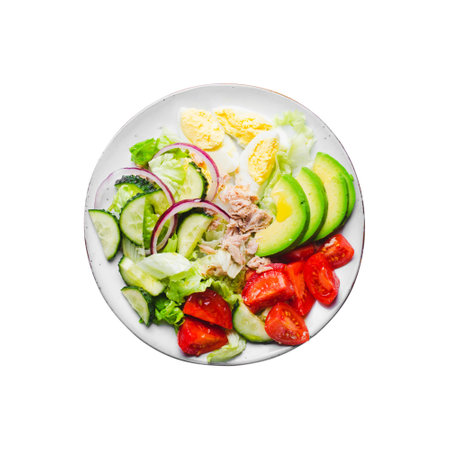Tuna Salad, Healthy Food, Fresh Salad with Lettuce, Avocado, Cherries, Cucumber and Eggs on a Plate on White Background Isolatedの写真素材