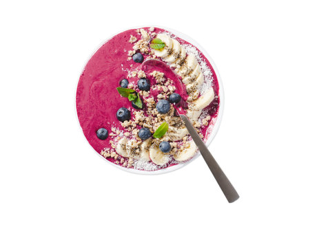 Blueberry Smoothie Bowl with Granola, Banana, and Chia Seeds on White Background Isolated, Vegan or Vegetarian Foodの写真素材