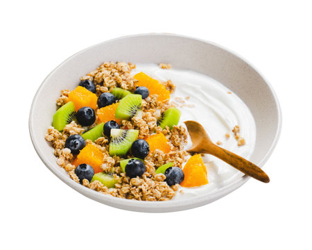 Yogurt with Granola, Kiwi, Blueberries, and Orange in a Bowl, Healthy Snack or Breakfast, White Isolated Backgroundの写真素材