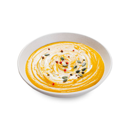 Sweet Potato Soup, Fresh Homemade Pumpkin, Sweet Potato, Carrot Soup in a Bowl on White Isolated Backgroundの写真素材