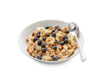Oatmeal Bowl, Oat Porridge with Blueberry, Banana and Pecans in a Bowl on White Background Isolated, Healthy Snack or Breakfastの写真素材