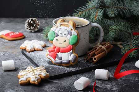 Cute Cow Gingerbread Cookie on Dark Wooden Background, Christmas Treatの写真素材