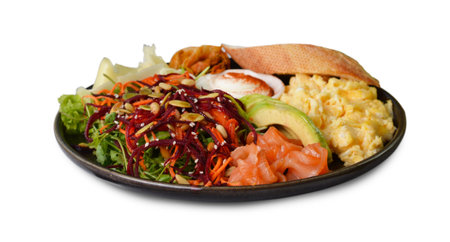 Healthy Breakfast with Salmon, Scrambled Eggs, Avocado, Vegetable Salad and Toppings on White Isolated Backgroundの写真素材